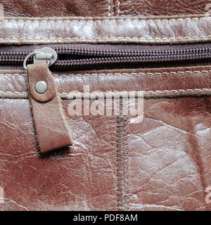 Zip on a leather bag. Close up Stock Photo