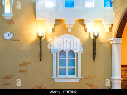 The lamp in the apartment, made like a torch in the middle of the castle. Antique design Stock Photo