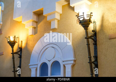 The lamp in the apartment, made like a torch in the middle of the castle. Antique design Stock Photo