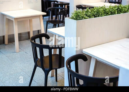 The bamboo surface of the table. Bamboo Cutting Board Texture Wooden Background. Round Cup holders made of cork. For glasses of hot drinks. Stock Photo