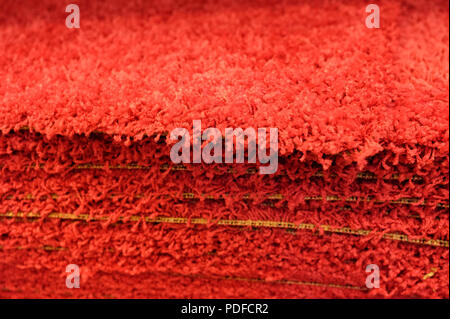 Stack gray bath mats bath mats Stack, stacked on top of each other. Terry mats. Stock Photo