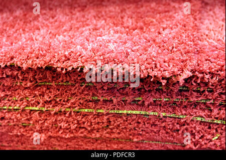 Stack gray bath mats bath mats Stack, stacked on top of each other. Terry mats. Stock Photo