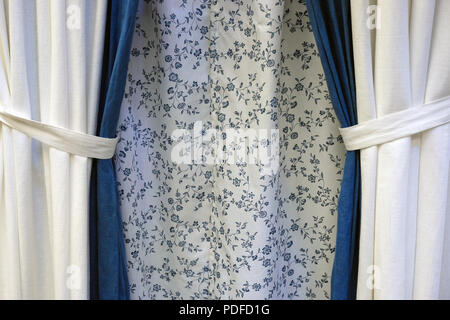 Modern interior view from the window with a curtain. Lifestyle. The atmosphere of home comfort. Stock Photo