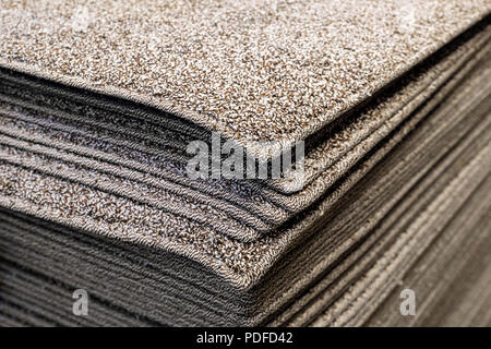 Stack gray bath mats bath mats Stack, stacked on top of each other. Terry mats. Stock Photo