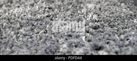 Stack gray bath mats bath mats Stack, stacked on top of each other. Terry mats. Stock Photo