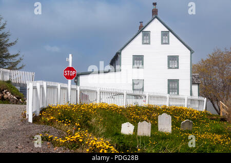 A white weatherboarded house on a foggy day in Trinity on the Bonavista peninsula, Newfoundland. Stock Photo