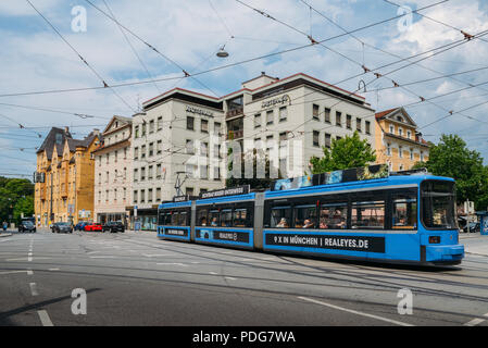 Munich, Germany - July 28, 2018: Blue eletric tram on shopping street in Munich, Bavaria, Germany Stock Photo