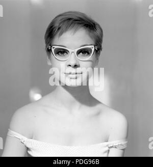 1960s glasses. A young woman in glasses and bows January 1961. Models name Monica Flodqvist Stock Photo