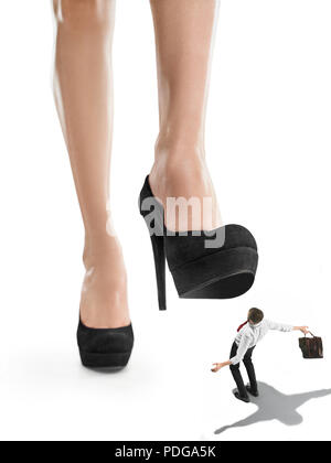 Woman domination concept with shoes and man Stock Photo - Alamy