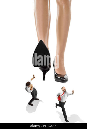 Woman domination concept with shoes and man Stock Photo - Alamy