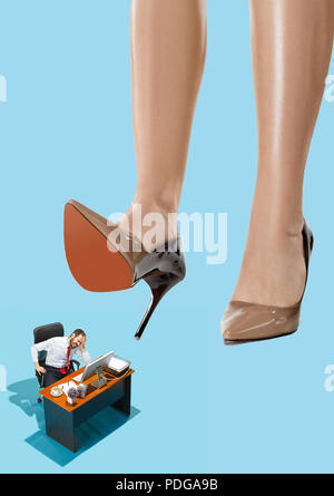 Woman domination concept with shoes and man Stock Photo - Alamy