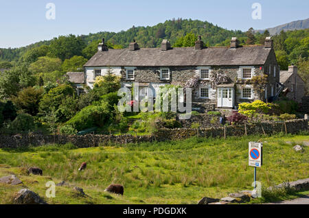 Row of cottages houses homes in summer Elterwater village Langdale Valley Cumbria England UK United Kingdom GB Great Britain Stock Photo