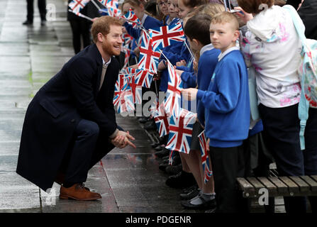 Prince Harry and Ms Meghan Markle are greeted by school children as they arrive at Millennium Point in Birmingham Stock Photo