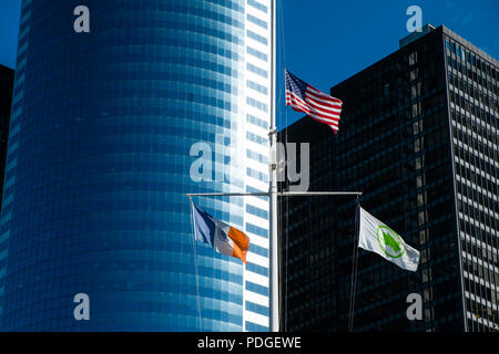 American flags flying on the skyscrapers in the Manhattan neighborhood ...