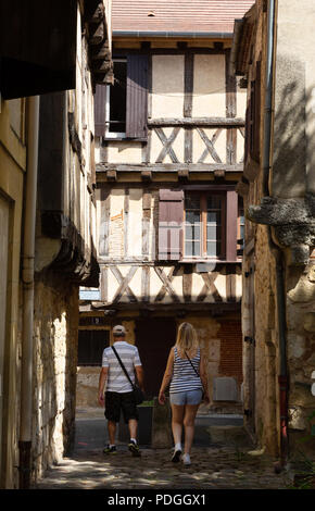 Tourist couple exploring the narrow streets of medieval Bergerac old town, Bergerac, Dordogne, France Europe Stock Photo