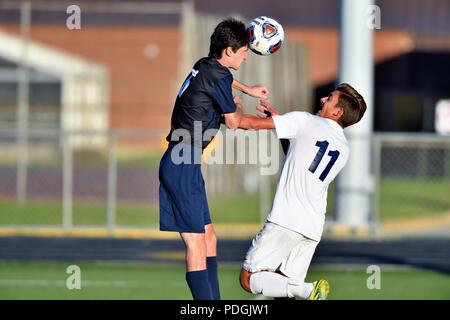 Player executing a header above an opponent.  USA. Stock Photo