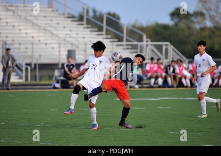 Opposing players striving to control an elusive ball. USA. Stock Photo