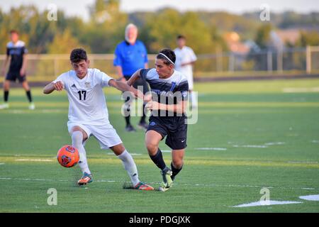 Opposing players battling along the sideline for possession of the ball. USA. Stock Photo