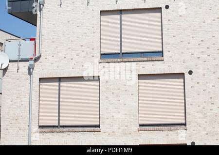 white windows with blinds pulled down Stock Photo