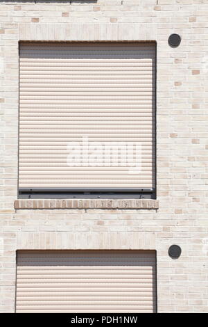 white windows with blinds pulled down Stock Photo