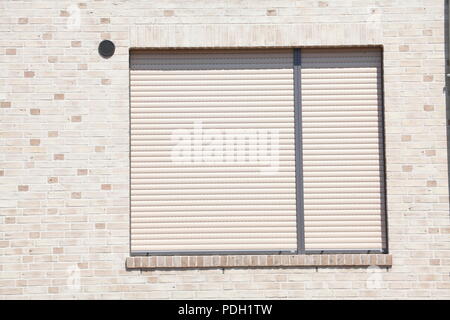 white windows with blinds pulled down Stock Photo