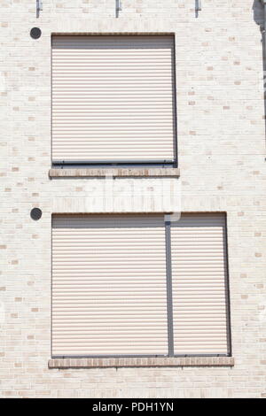 white windows with blinds pulled down Stock Photo