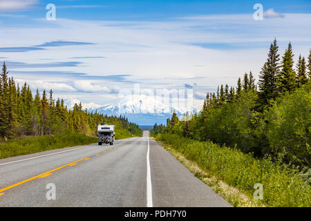 RV on straight smooth section of the Glenn Highway between Anchorage and Glennallen Alaska Stock Photo