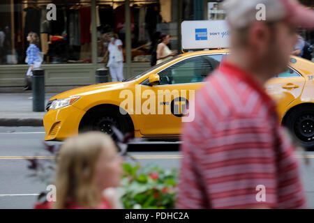 New York, USA. 9th Aug, 2018. A yellow cab is seen on a street in Manhattan, New York City, the United States, Aug. 9, 2018. New York City Council passed regulations on for-hire vehicle industry on Wednesday, placing a year-long cap on the number of for-hire vehicles on the road. The app-based transportation industry in New York City includes about 80,000 vehicles, dwarfing the city's 13,587 medallion taxis, according to a latest study by the New School for the Taxi and Limousine Commission. Credit: Li Muzi/Xinhua/Alamy Live News Stock Photo