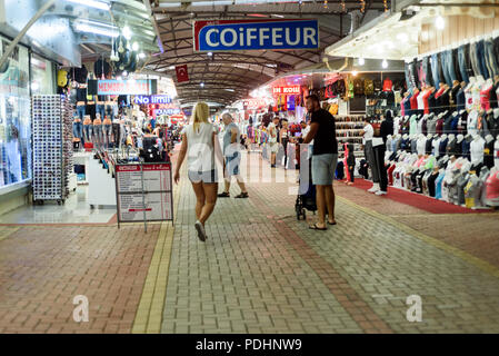 ANTALYA, TURKEY, 14TH JULY 2018 - Tourists enjoy browsing the goods inside the Alara Grand Bazaar in the summer of 2018 as they look to purchase affor Stock Photo