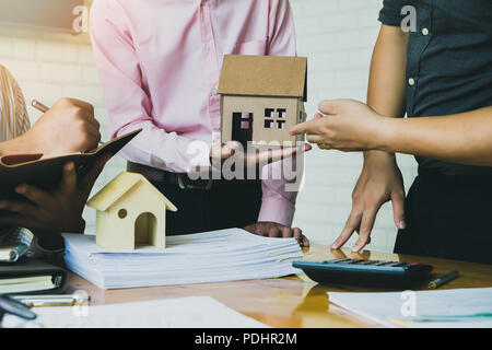 Confident team of architect working together in a office.They discussing about new startup project on desk. Stock Photo