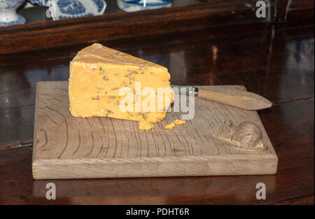 Antique cheese board with a mouse carving in the righthand corner Stock Photo