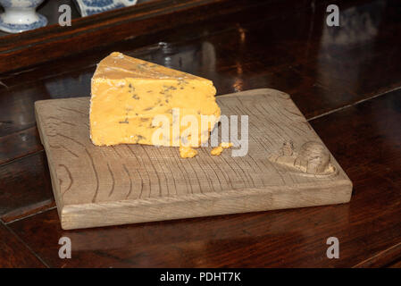 Antique cheese board with a mouse carving in the righthand corner Stock Photo