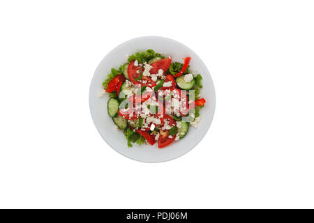 Shopska salad in a white plate isolated on white background. The concept of minimalism. Stock Photo
