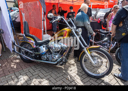 Customized hard tail chopper motorcycle  with glitter paint fuel tank on display at Calne bike meet Stock Photo
