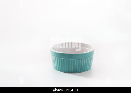 Porcelain souffle ramekin dish isolated on white background. Stock Photo