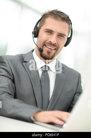 young agent of the call center with the headphones. Stock Photo