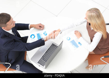 handshake colleagues after drawing up a new financial plan Stock Photo