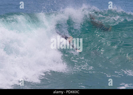 Bodysurfing at the world famous Wedge in Newport Beach California Stock Photo