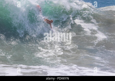 Bodysurfing at the world famous Wedge in Newport Beach California Stock Photo