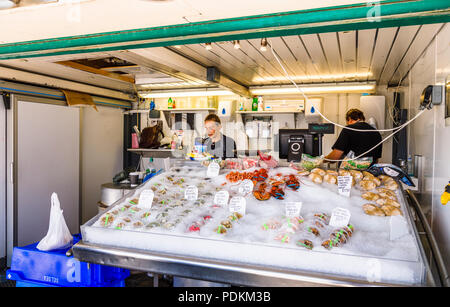Stall selling fresh seafood on display in Littlehampton, a small holiday resort on the south coast in West Sussex, UK in summer Stock Photo