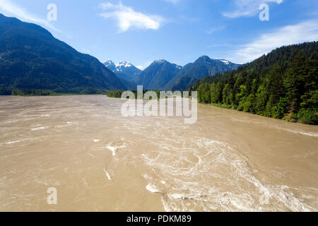 Rapids in the springtime flowing water of the Fraser River in Hope, British Columbia, Canada. Stock Photo