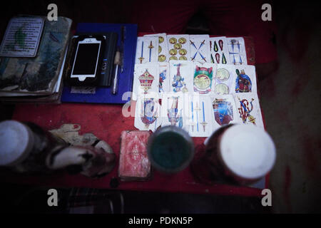 Black magic Brujos or witch doctors, in Catemaco, Veracruz.  Surrounded by dried animals, candles and other objects of black witch craft in Catemaco, Mexico. Stock Photo