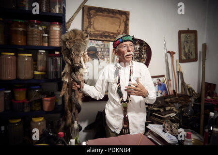 Black magic Brujos or witch doctors, in Catemaco, Veracruz.  Surrounded by dried animals, candles and other objects of black witch craft in Catemaco, Mexico. Stock Photo