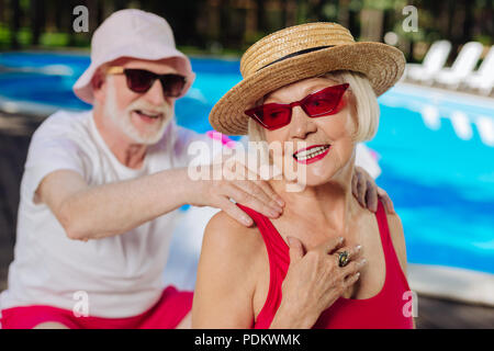Mature woman feeling happy spending time with caring husband Stock Photo