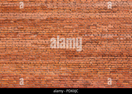 Red brick wall of an old building, background texture of a brick Stock Photo