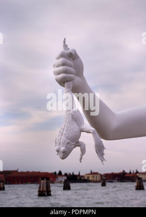 statue of hand holding a frog. Venice, Italy Stock Photo