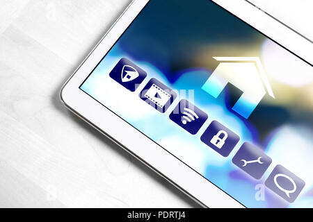 Smart home application in tablet to control house appliances. Internet of things (IOT) and remote controller app on smart device. Stock Photo