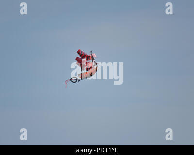 Pirate ship-shaped kite in flight Stock Photo