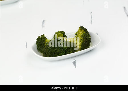 Healthy Green Broccoli in plate Stock Photo