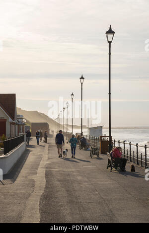 Tourists enjoying a beautiful spring afternoon on the promenade at Saltburn-by-the-sea, North Yorkshire, England. Stock Photo